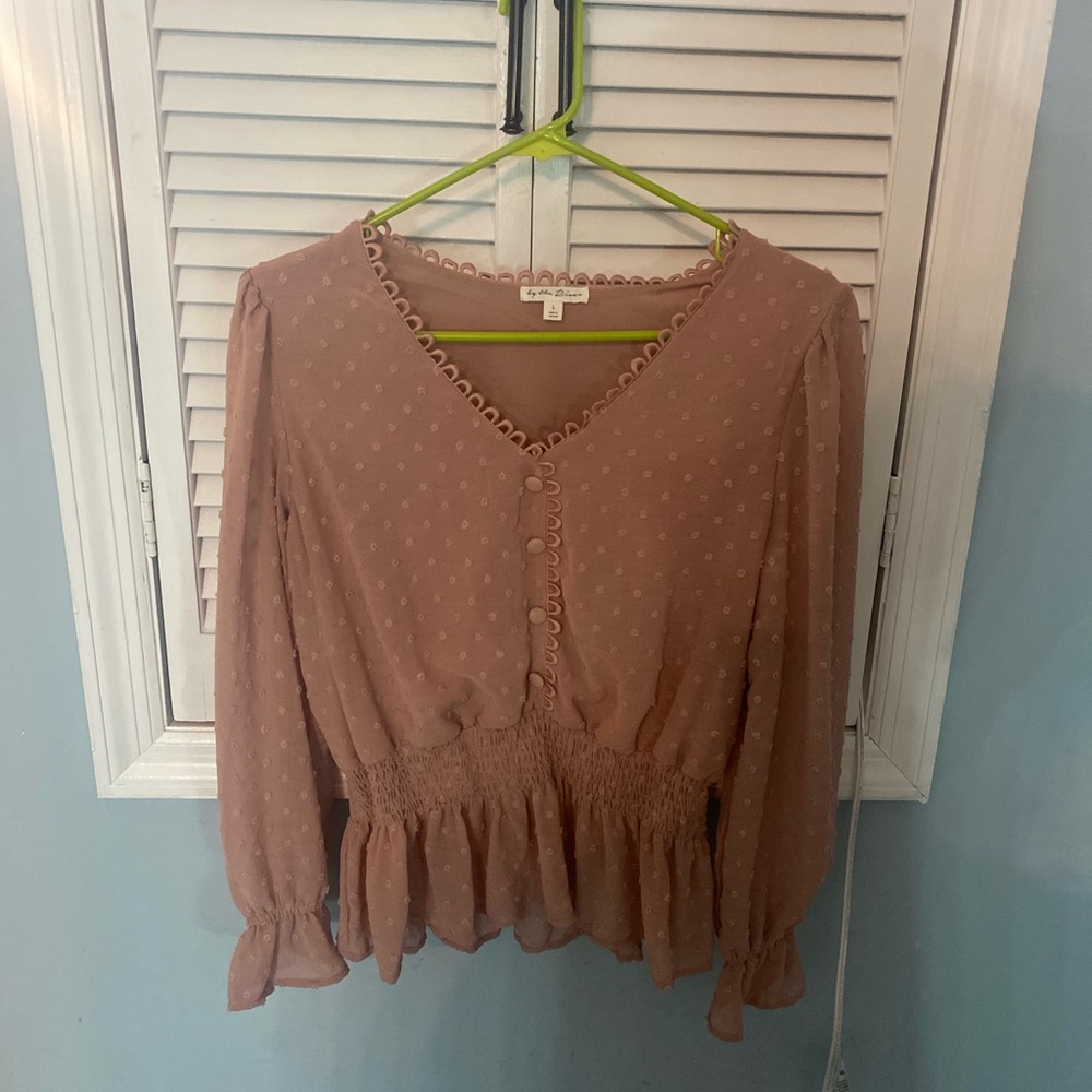 Bought this top at a Boutique. Love it but I never use it.